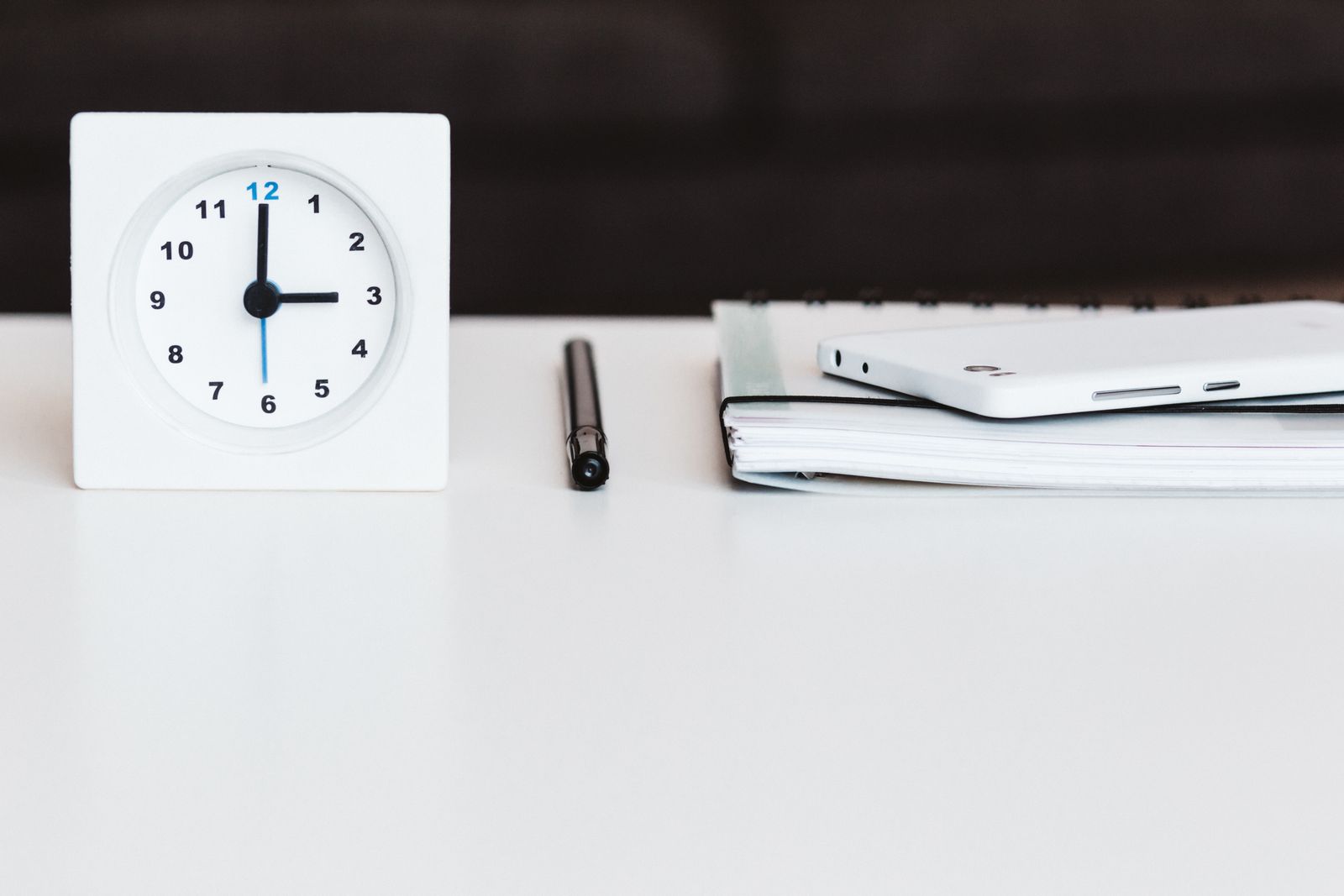 Alarm clock and desk supplies representing time management