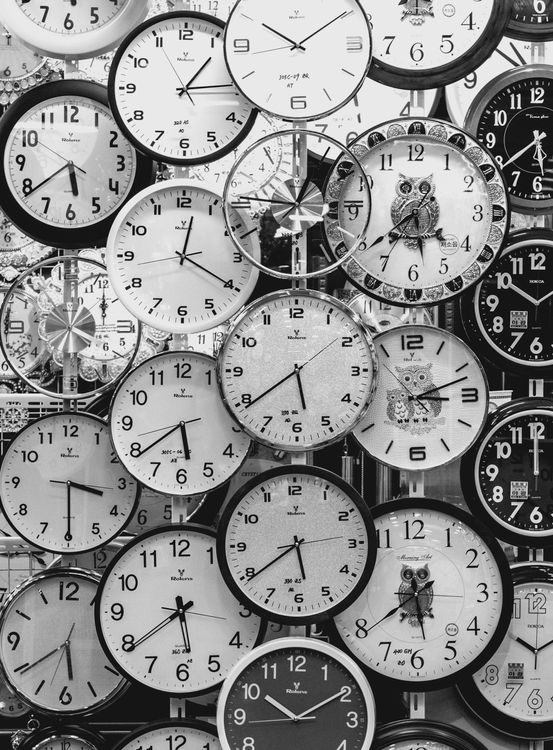 Black and white collage of clocks