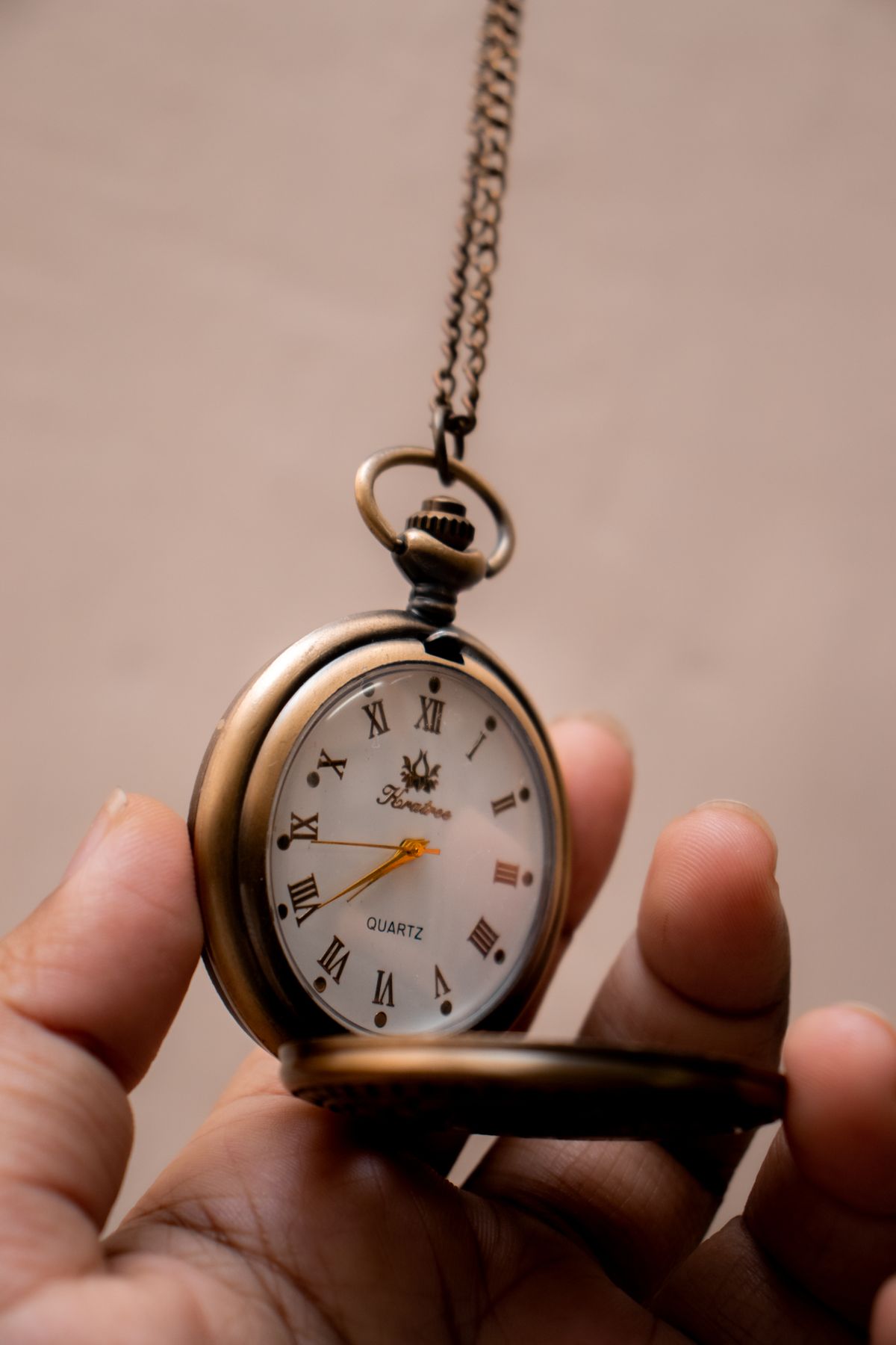 Close-up of a pocket watch representing time management